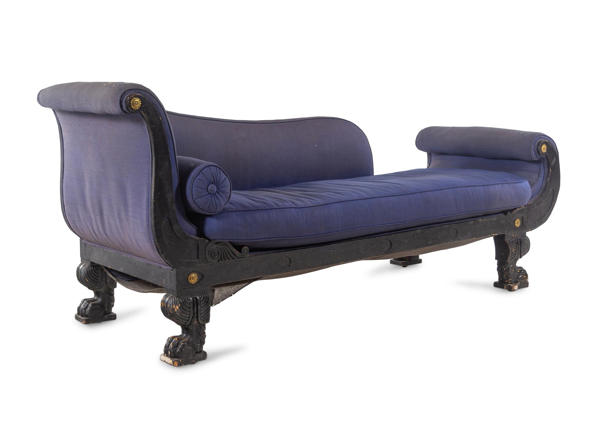 An Empire Style Gilt Metal Mounted Ebonized Chaise Longue