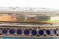 A Russian Silver and Enamel Snuff Box, Maker's mark obscured, Moscow, late 19th/early 20th century, of circular form, the case decorate