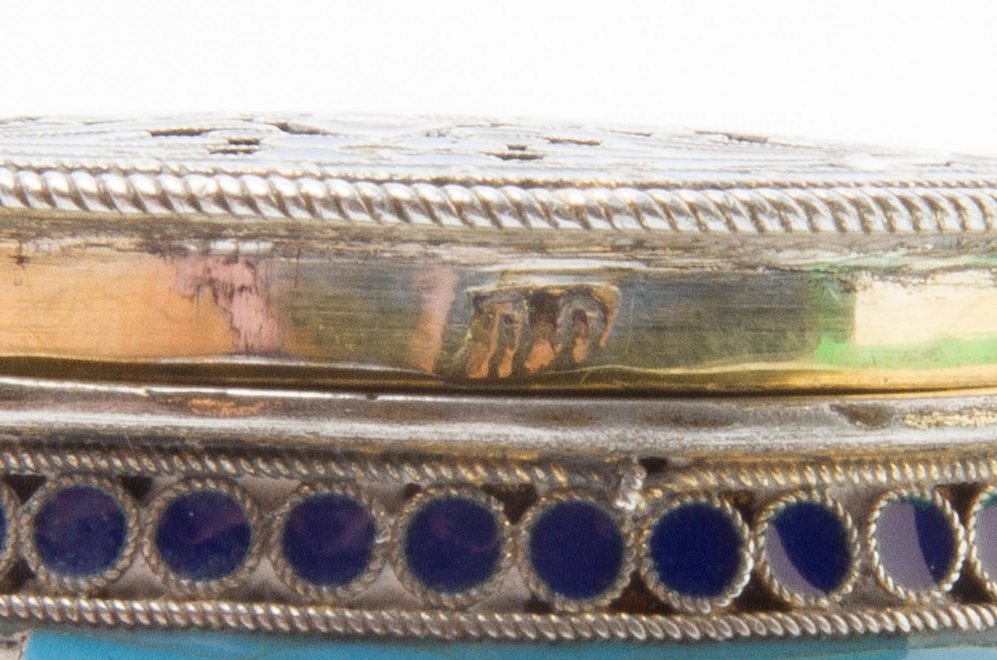 A Russian Silver and Enamel Snuff Box, Maker's mark obscured, Moscow, late 19th/early 20th century, of circular form, the case decorate
