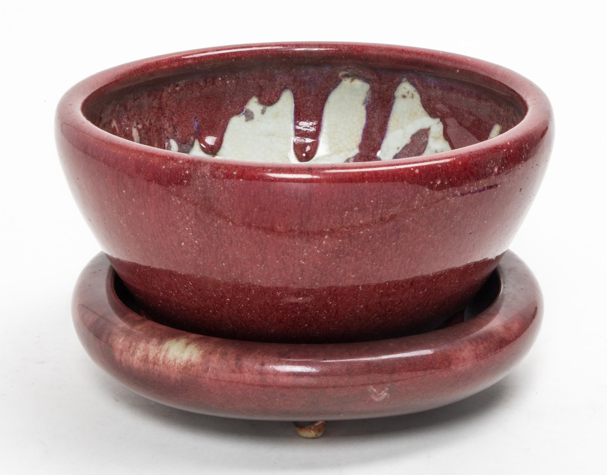 Two Red Glazed Stoneware Articles Diameter of larger 10 inches.