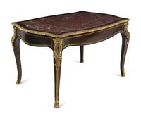 A Napoleon III Gilt Bronze Mounted Ebonized Marble-Top Center Table