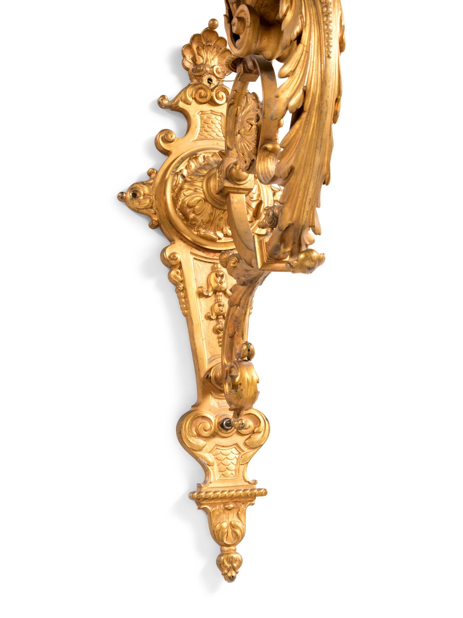 A Pair of French Neoclassical Gilt Bronze Eight-Light Sconces