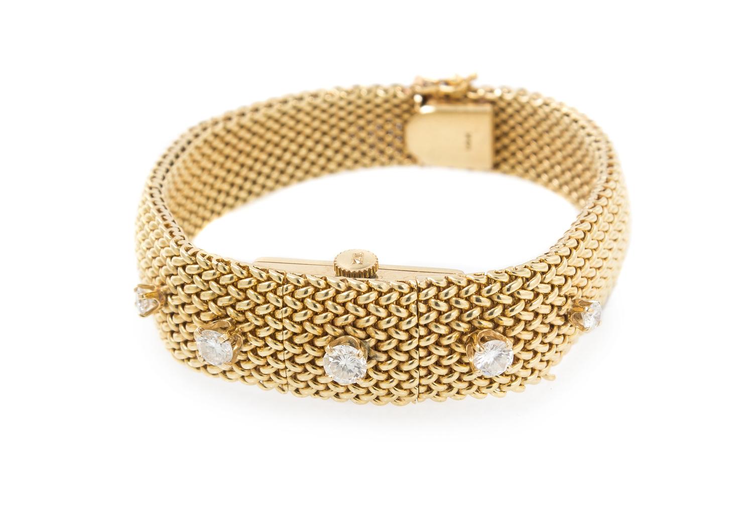 A 14 Karat Yellow Gold and Diamond Surprise Wristwatch, Geneva, 31.20 dwts.