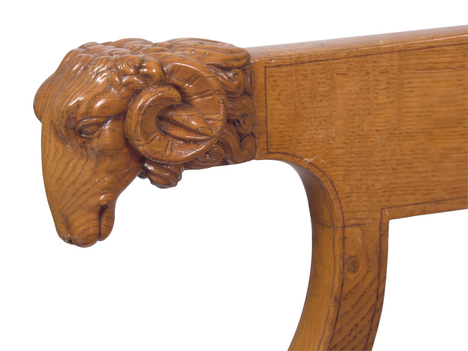 A Charles X Amaranth-Inlaid Golden Oak and Rams' Head Fauteuil