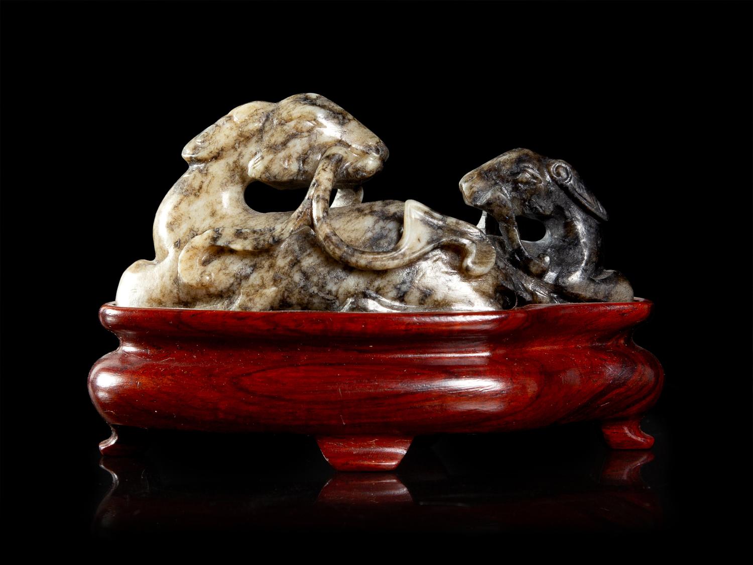 A Chinese Grey and Black Jade Figural Group of Double Rams