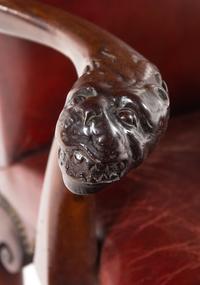 A George II Leather-Upholstered Carved Mahogany Library Chair