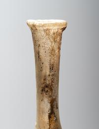 A Roman Pale Yellow Glass Unguentarium