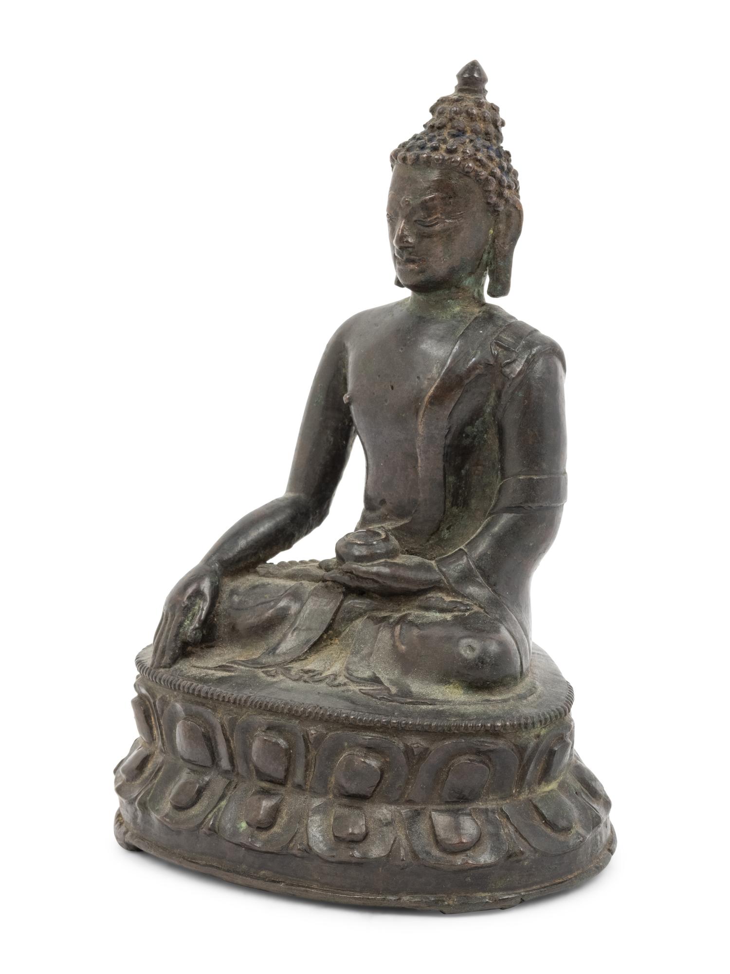 A Tibetan Bronze Figure of Seated Buddha Akshobhya