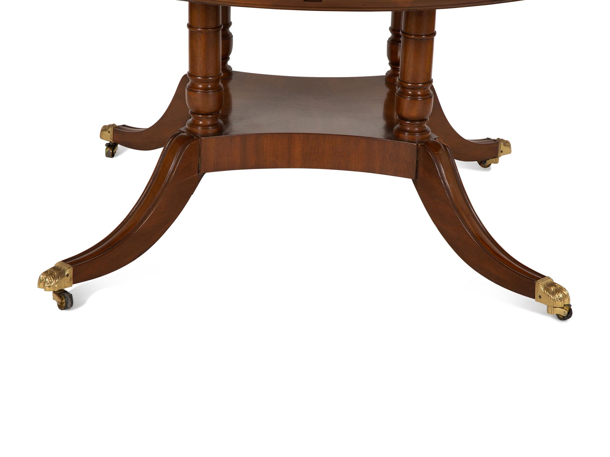 A Pair of Regency Style Mahogany Circular Dinner Tables