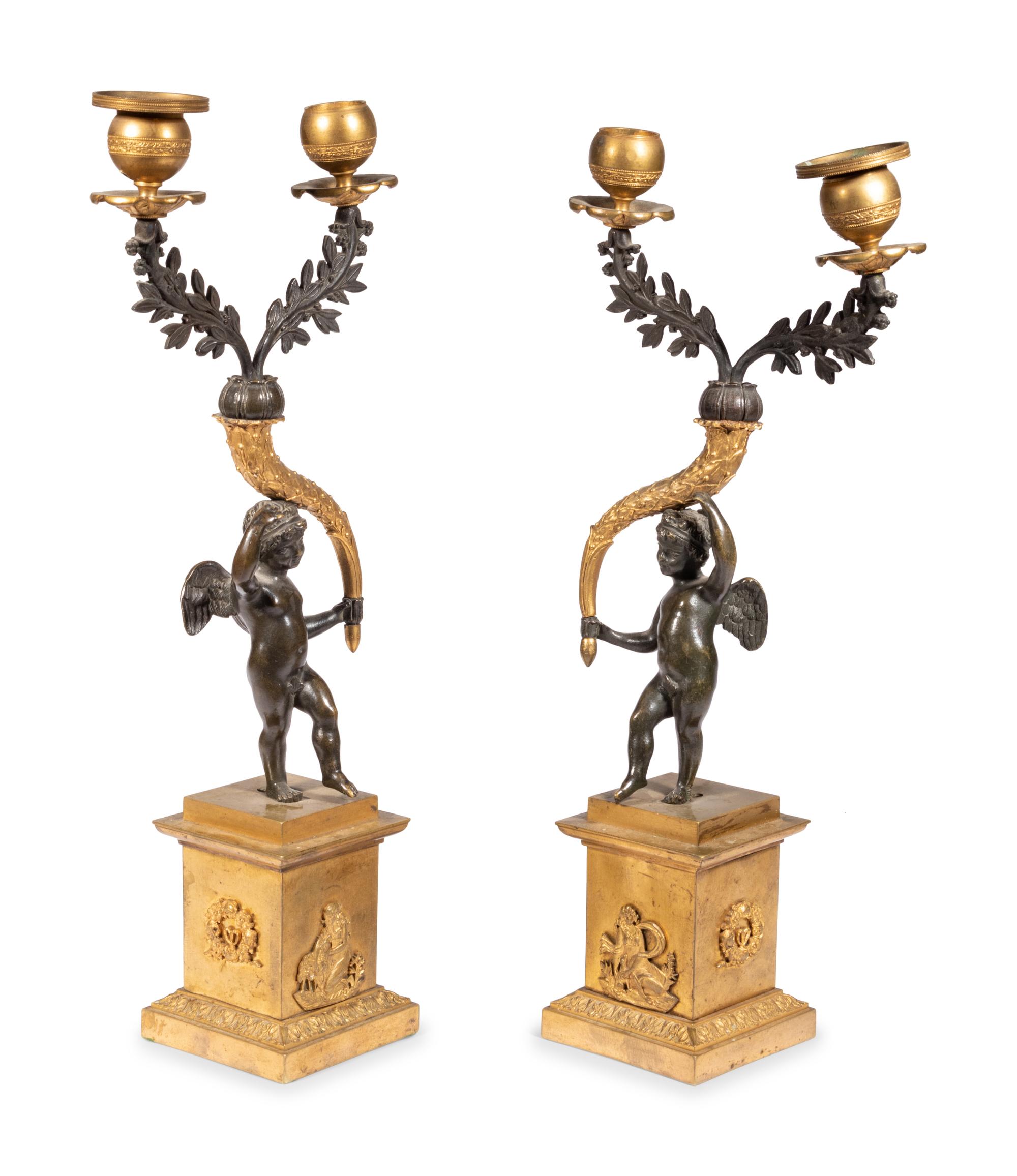 A Pair of Gilt and Patinated Bronze Figural Two-Light Candelabra