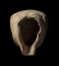A Veracruz Terracotta Head Wearing a Helmet with an Incised Glyph