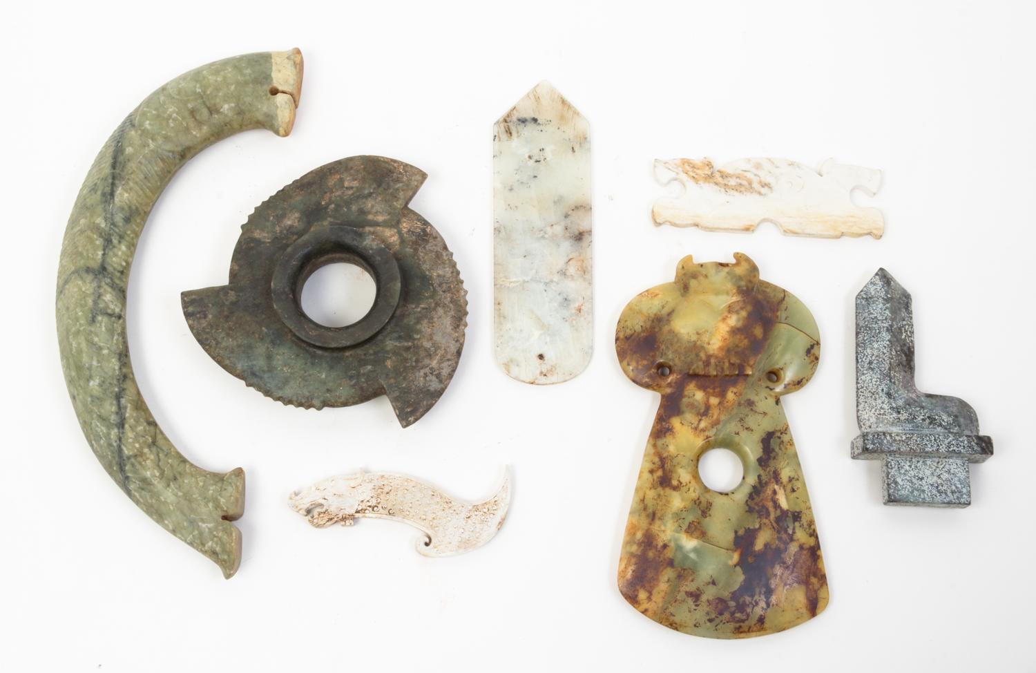 A Group of Eleven Archaic Jade Items Length of largest 14 inches.