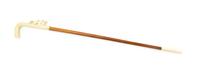 A Continental Relief Carved Ivory Cane, Height of handle 7 1/4 x length overall 34 1/8 inches.