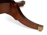 A Regency Style Mahogany Extending Circular Dining Table