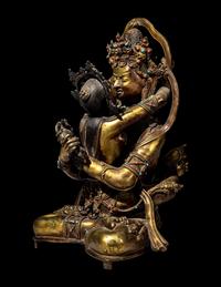 A Sino-Tibetan Hardstone Inset Gilt Bronze Figure of a Seated Bodhisattva and Consort