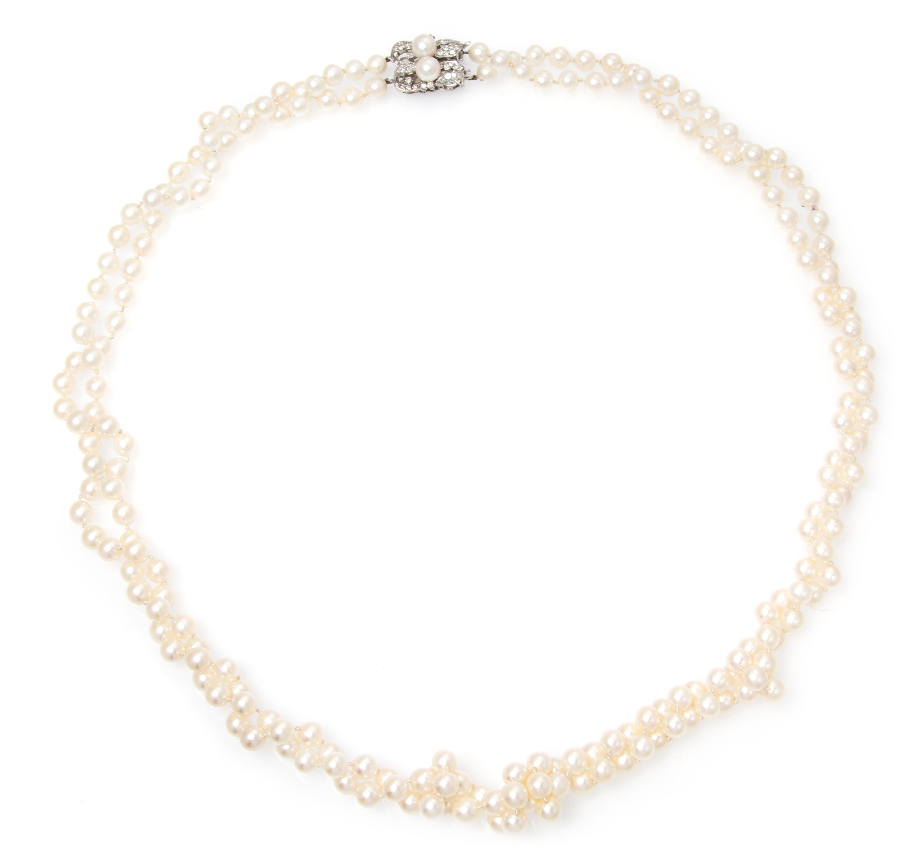 A Double Strand Cultured Pearl Necklace with White Gold and Diamond Clasp, 66.20 dwts.