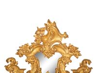 An Italian Baroque Style Giltwood Mirror