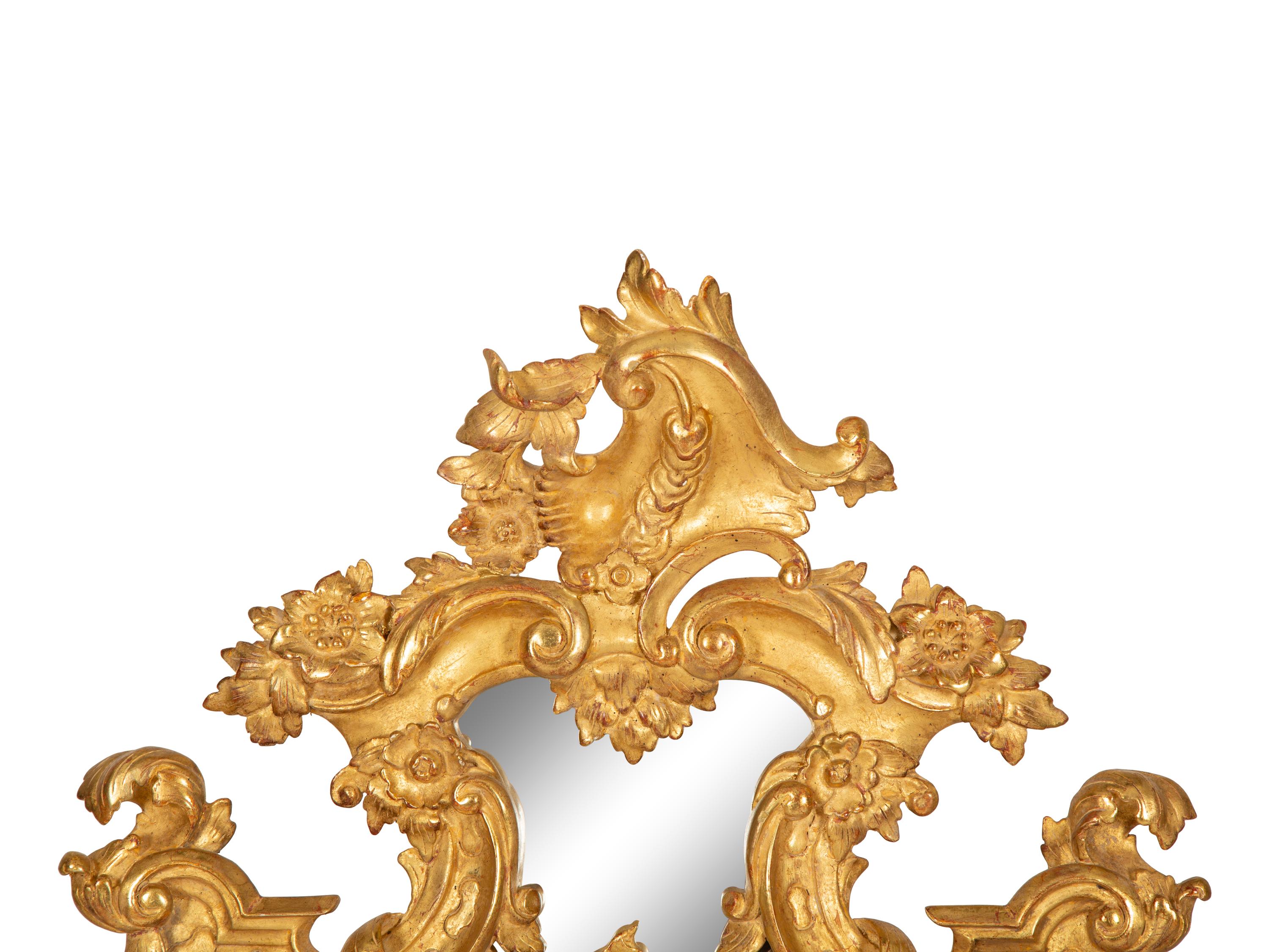 An Italian Baroque Style Giltwood Mirror