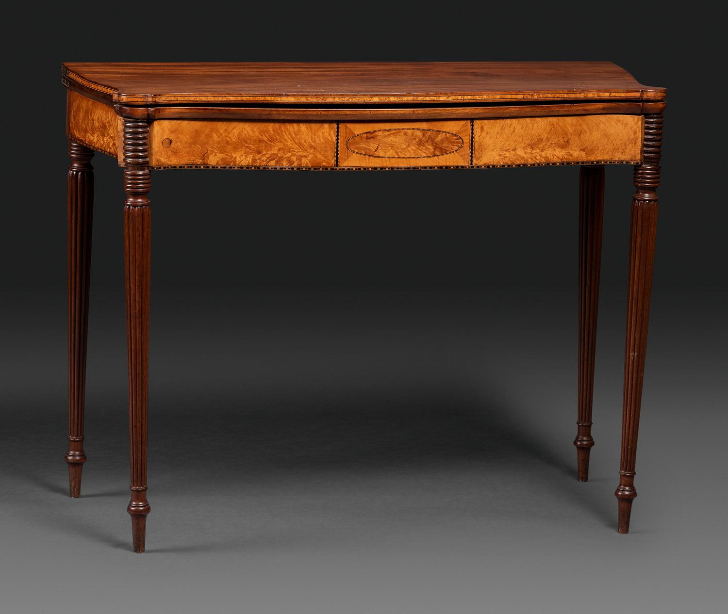 A Federal Birch Veneered and Inlaid Mahogany Serpentine-Top Games Table