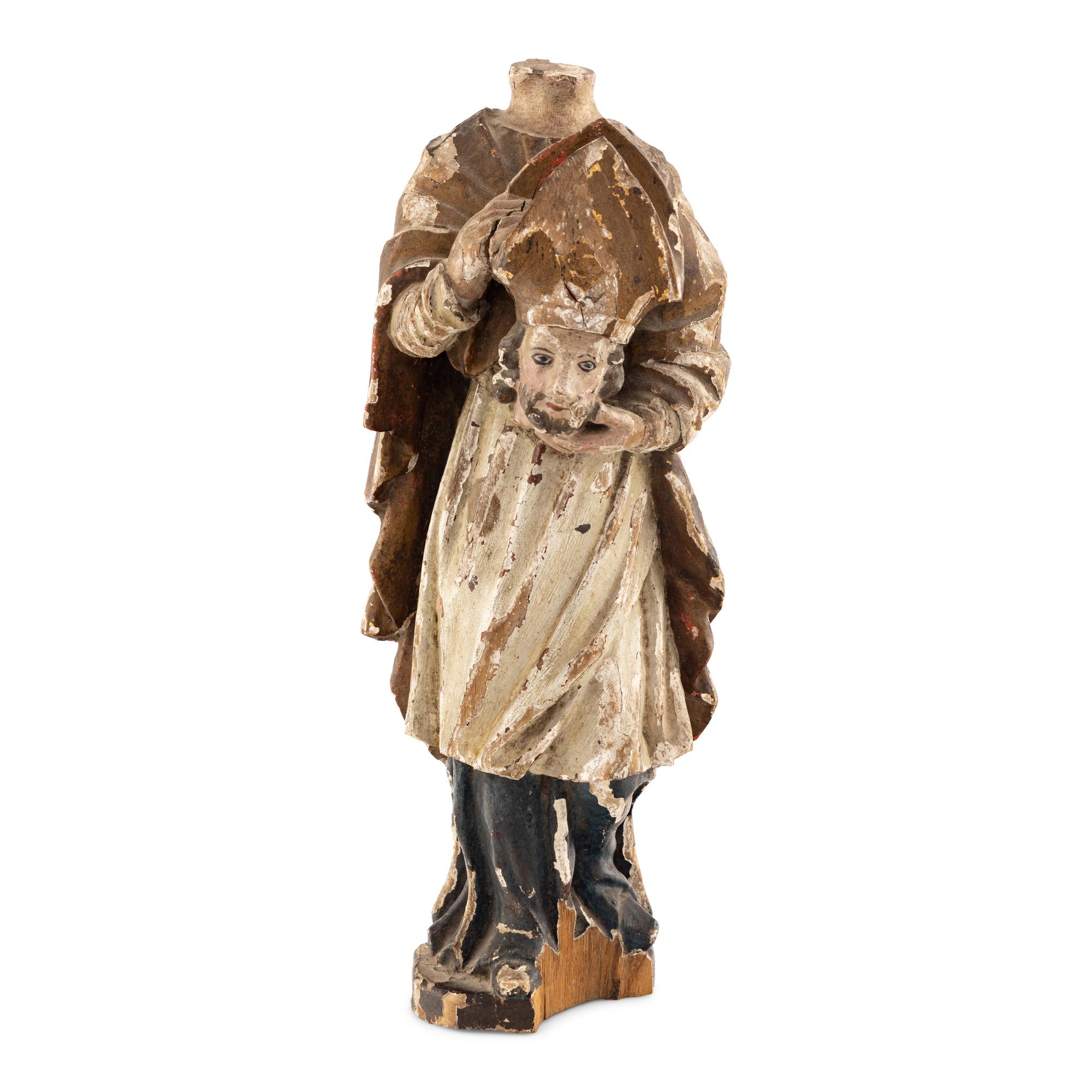 A Continental Carved Wood and Polychrome Decorated Cephalophore