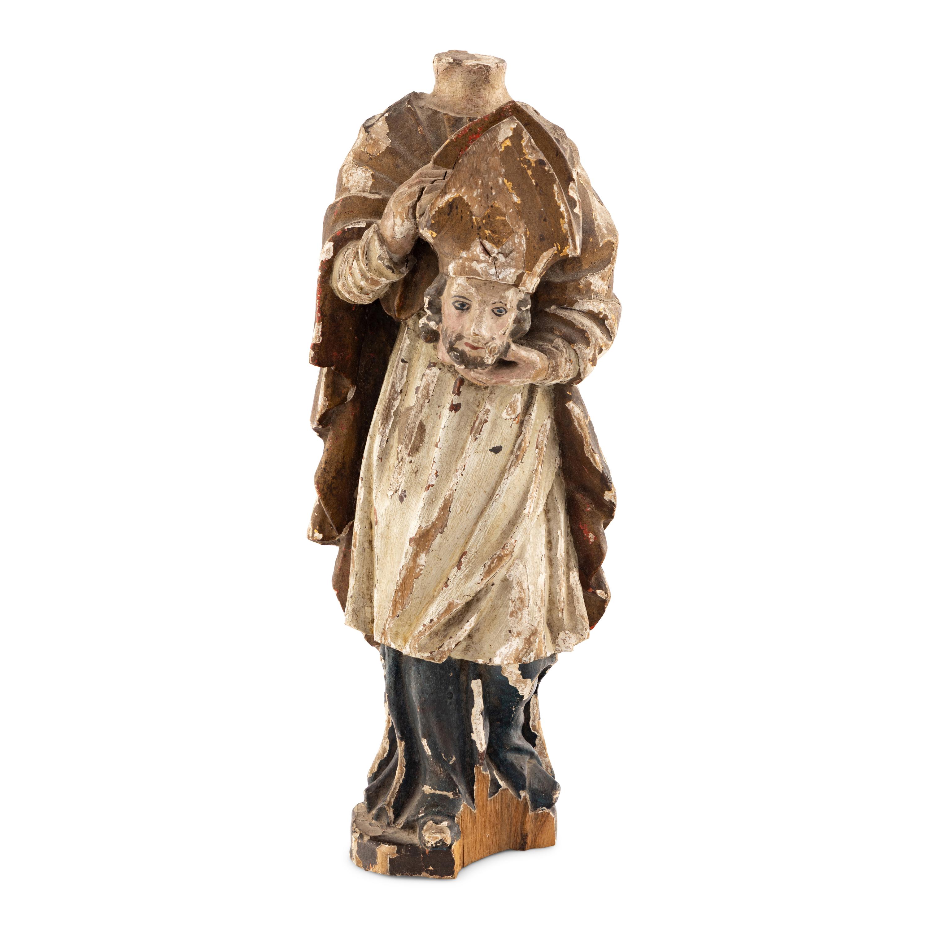 A Continental Carved Wood and Polychrome Decorated Cephalophore