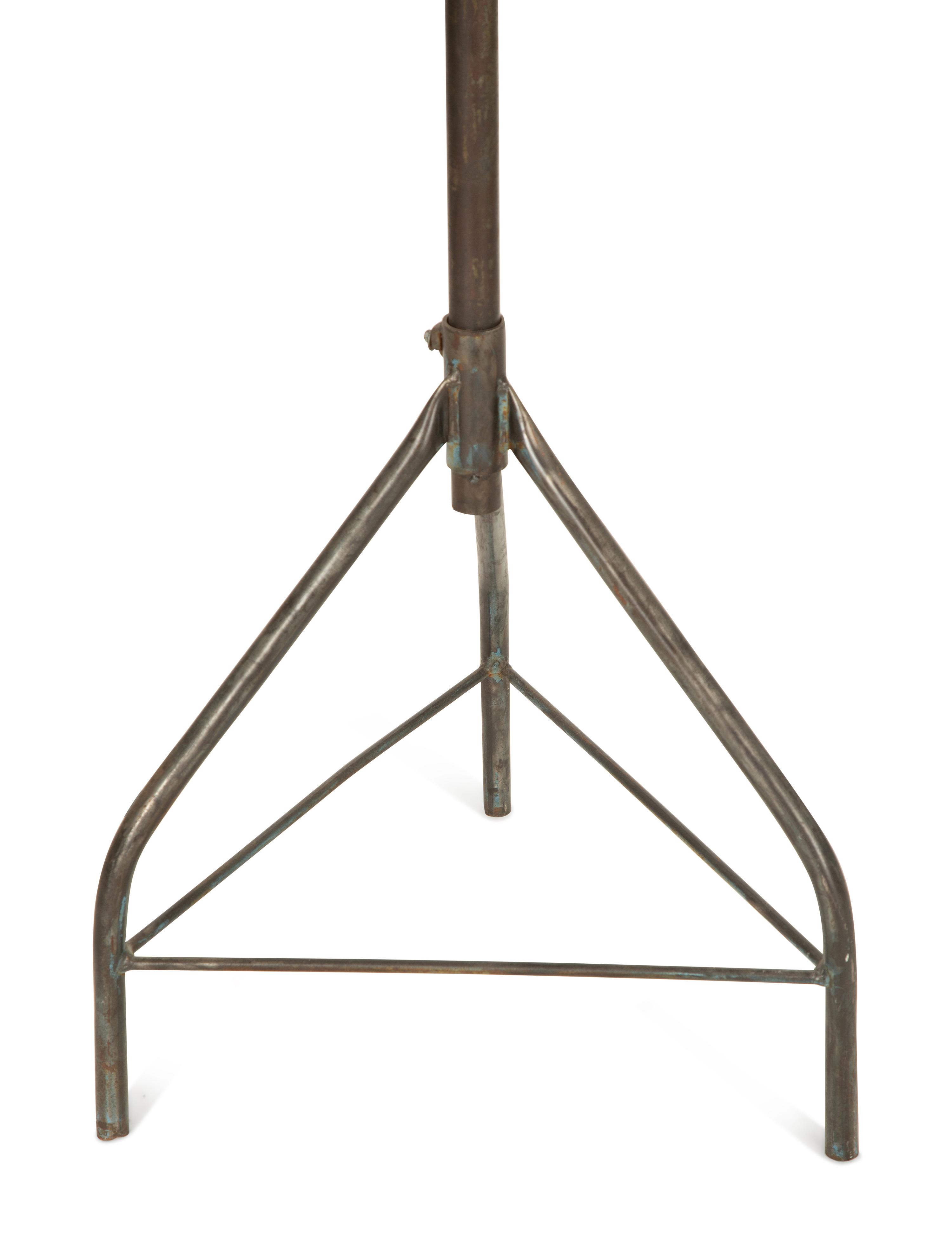 A Steel Tripod Base Articulated Floor Lamp