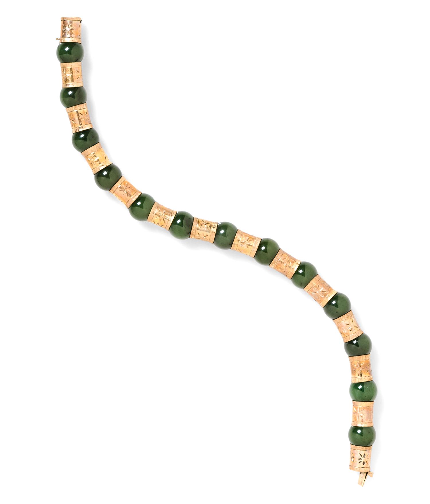 A 14 Karat Yellow Gold and Nephrite Jade Bracelet, 20.10 dwts.