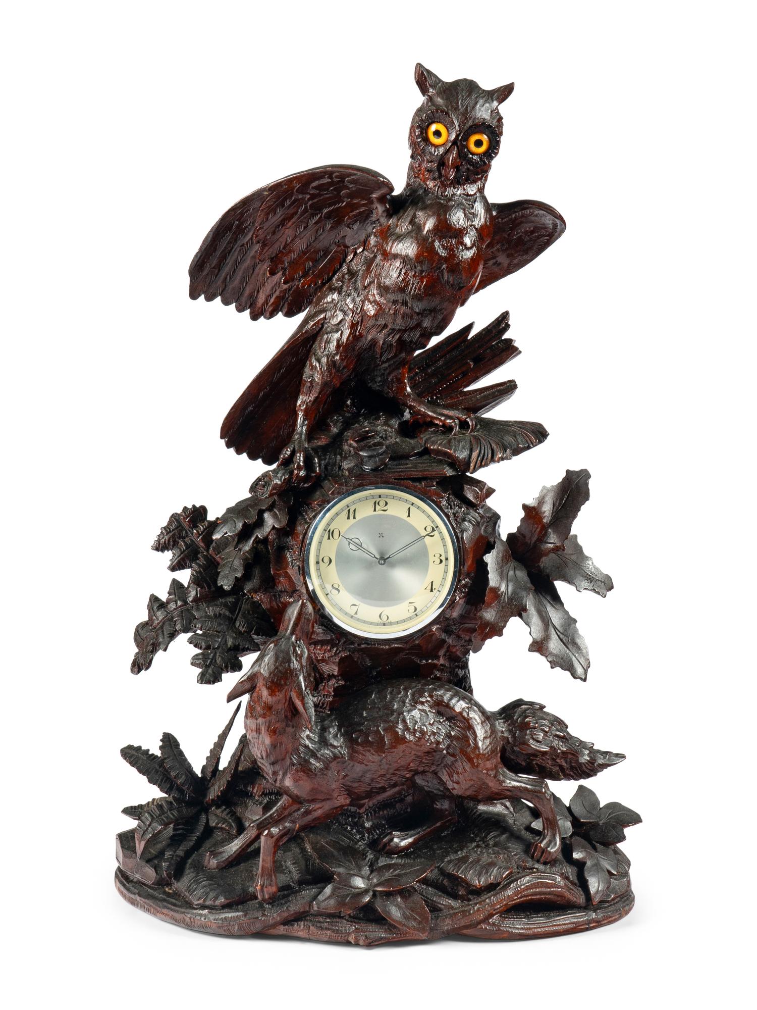 A Swiss "Black Forest" Carved Wood Clock