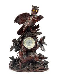 A Swiss "Black Forest" Carved Wood Clock