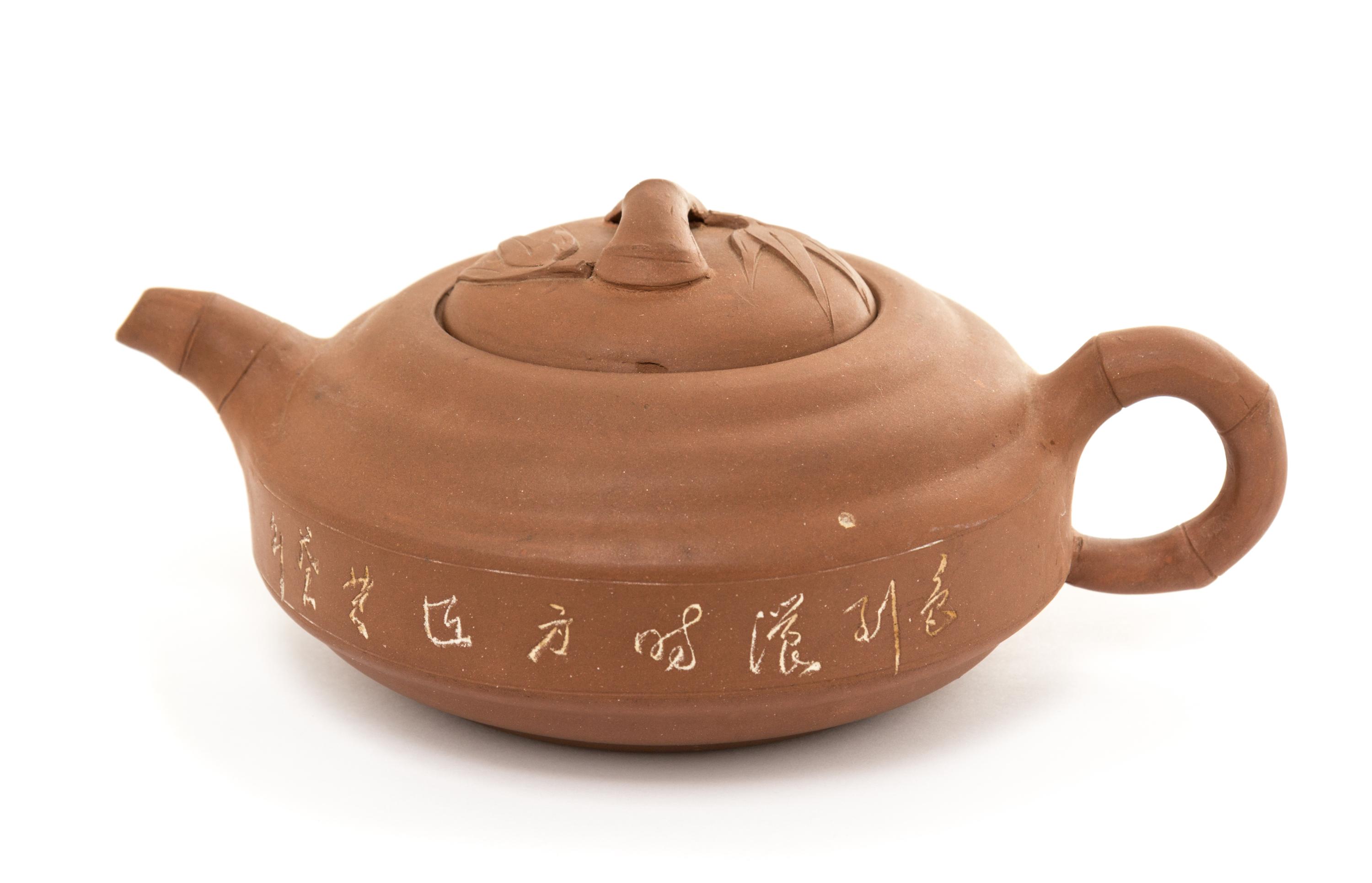 A Yixing Pottery Teapot Height 3 inches.