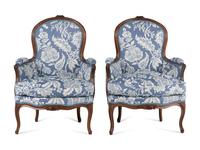 A Pair of Louis XV Walnut Bergères