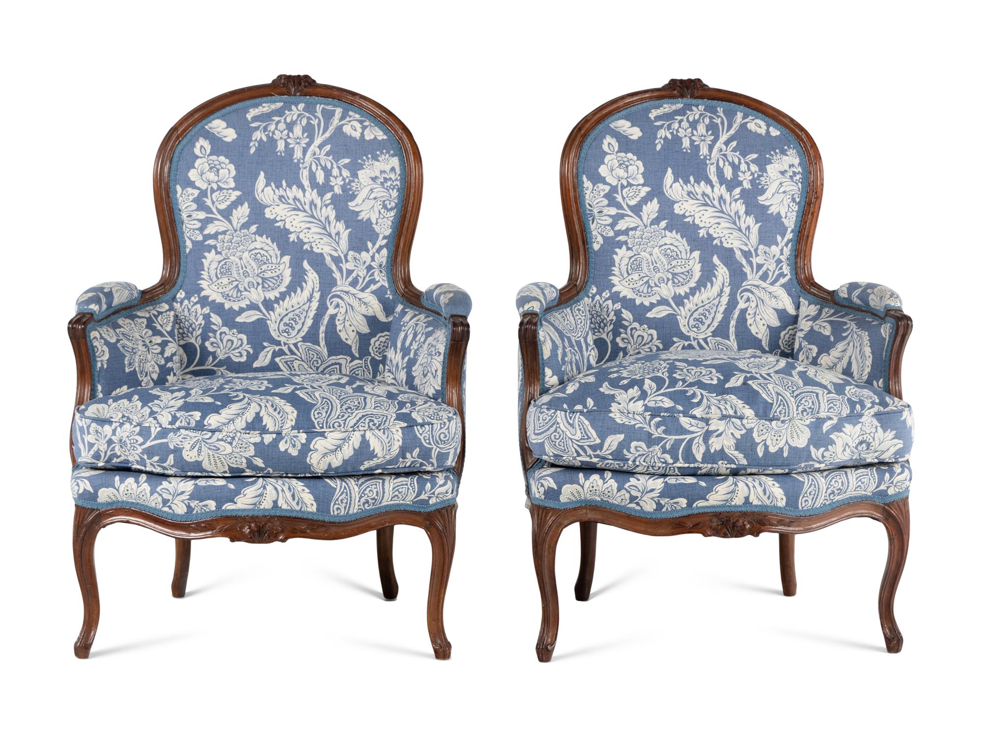 A Pair of Louis XV Walnut Bergères