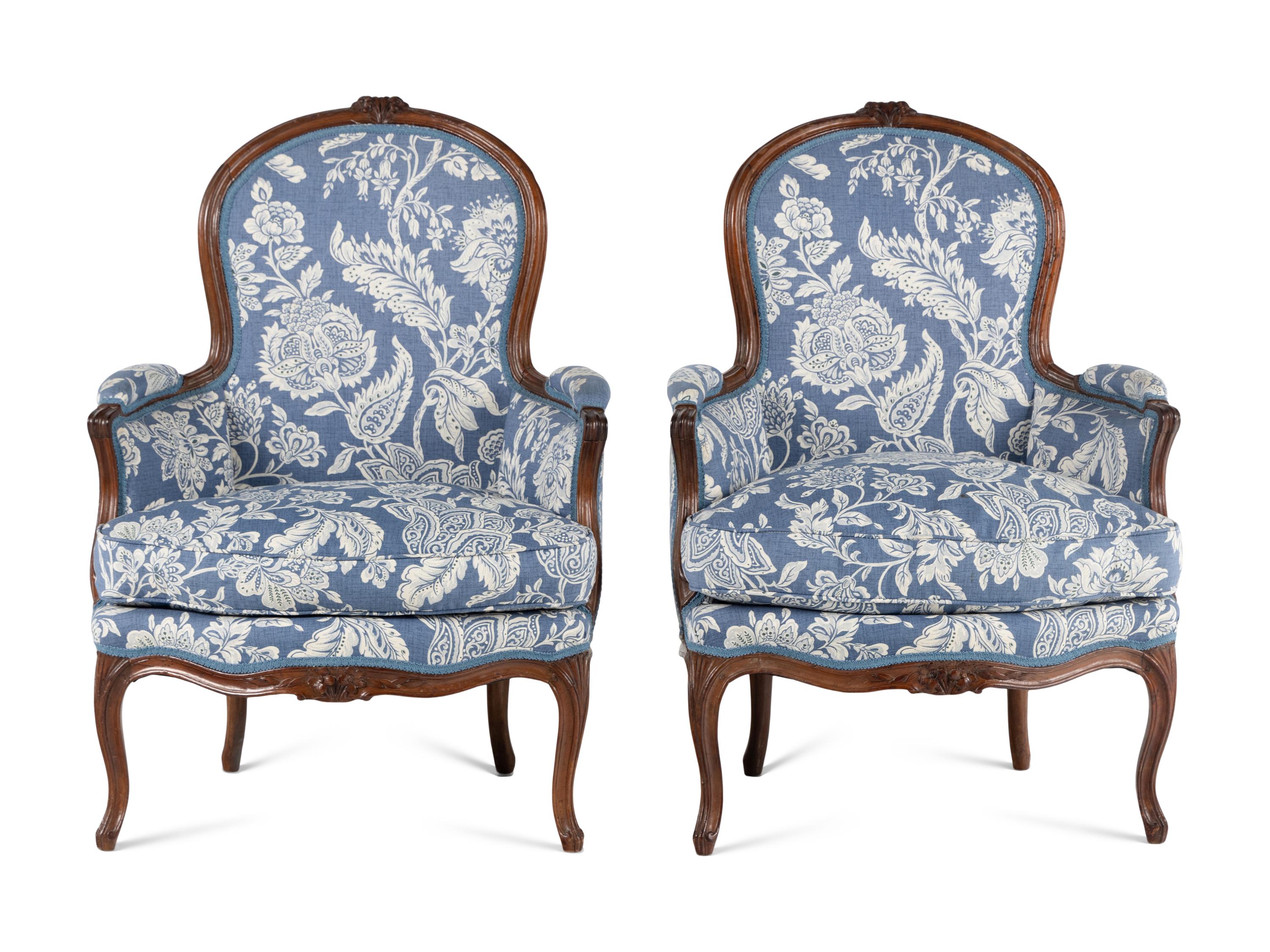 A Pair of Louis XV Walnut Bergères