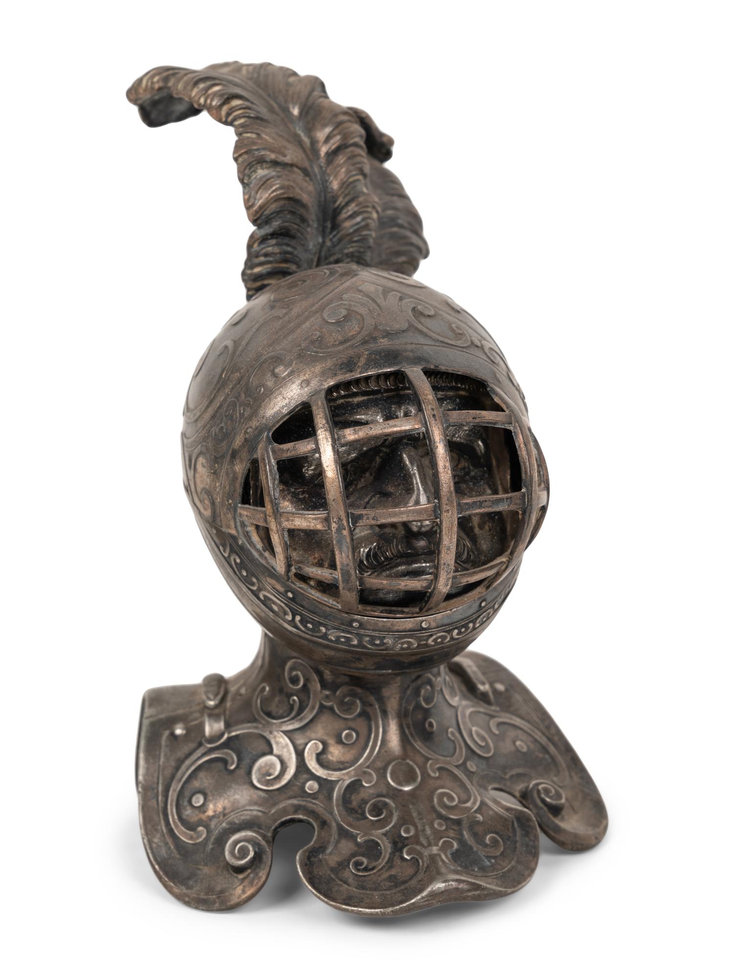 Two Knight Inkwells and a Helmet Inkwell