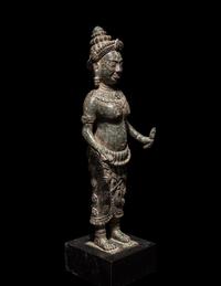 A Khmer Bronze Figure of a Deity