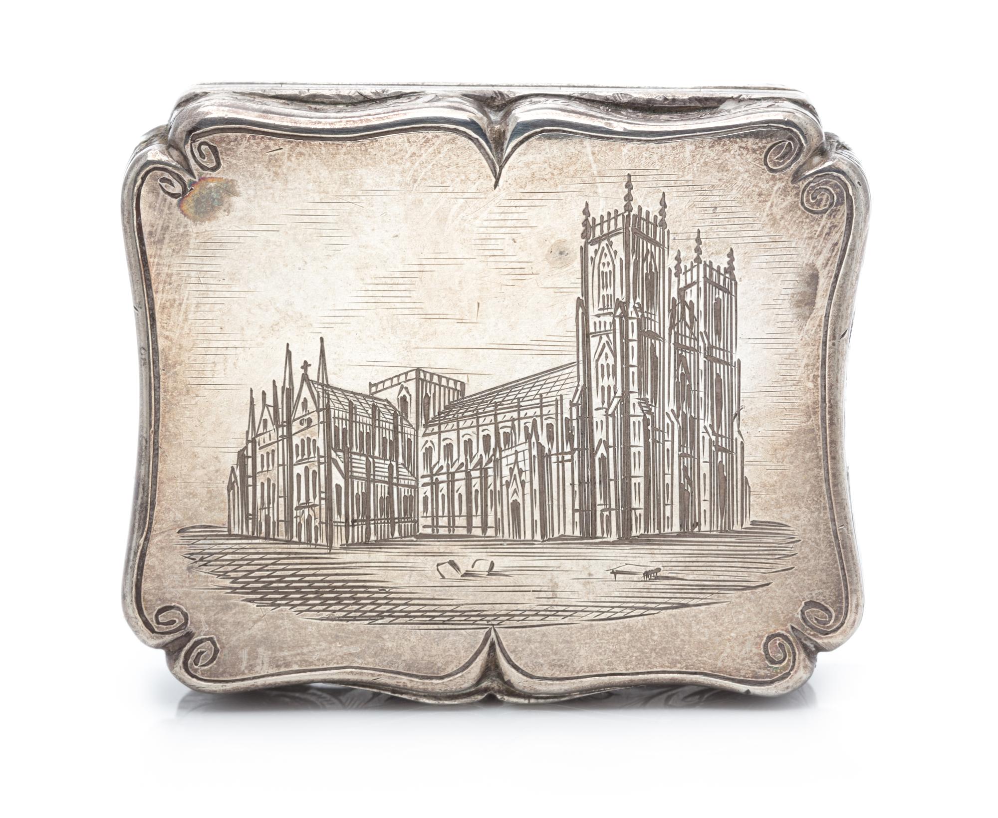 A Victorian Silver Vinaigrette, Edward Smith, Birmingham, 1843, the lid worked to depict a cathedral.