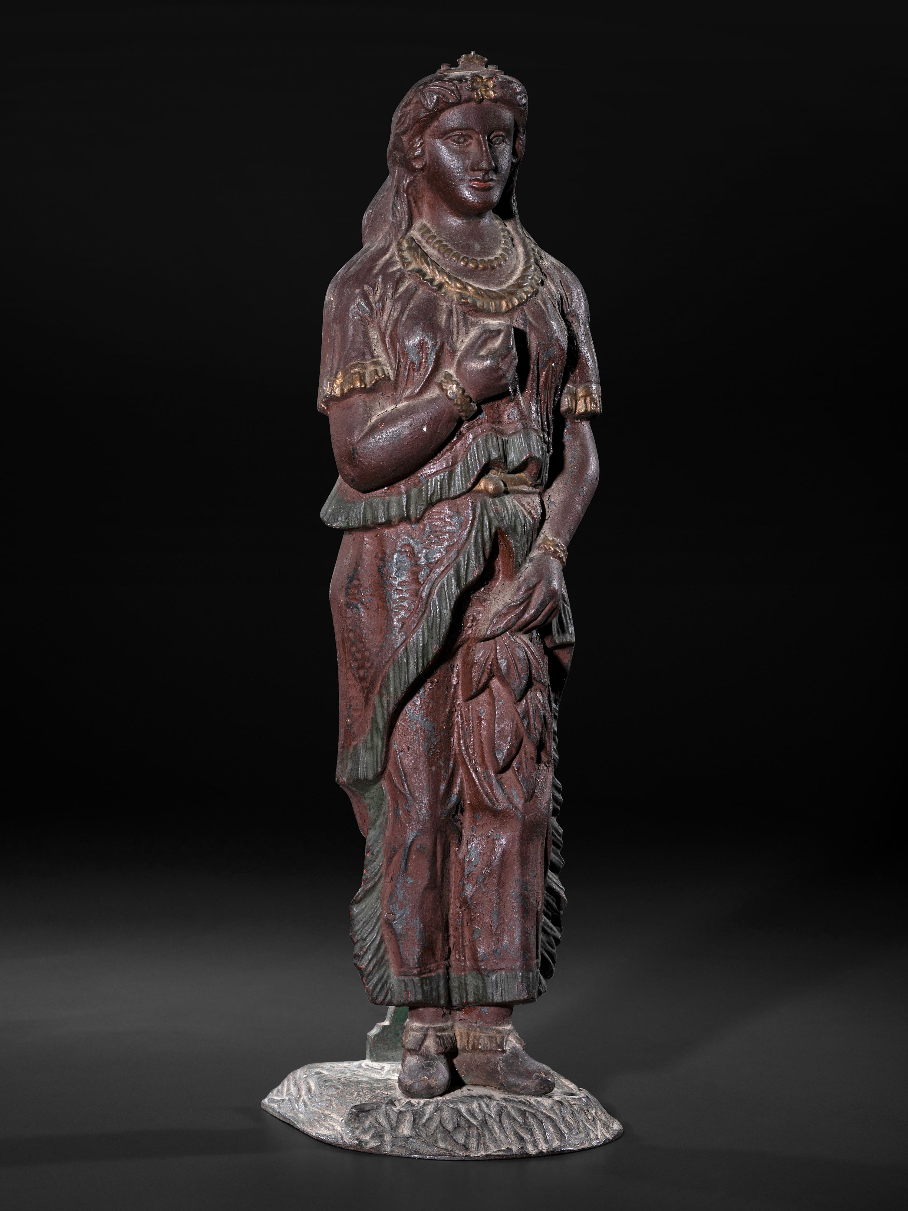 A Painted Cast Iron Tobacco Trade Figure of Native American Woman