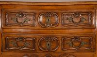 A Louis XV Provincial Style Carved Walnut Commode