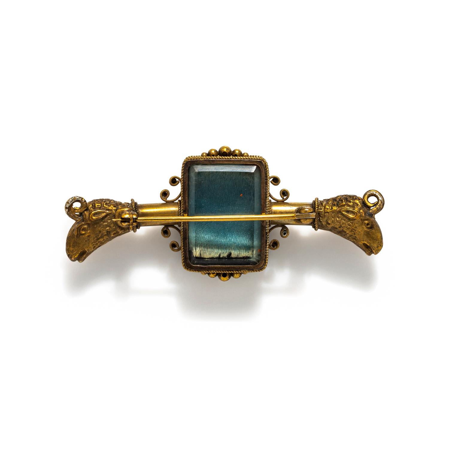 ANTIQUE, GILT AND CARVED INTAGLIO BROOCH