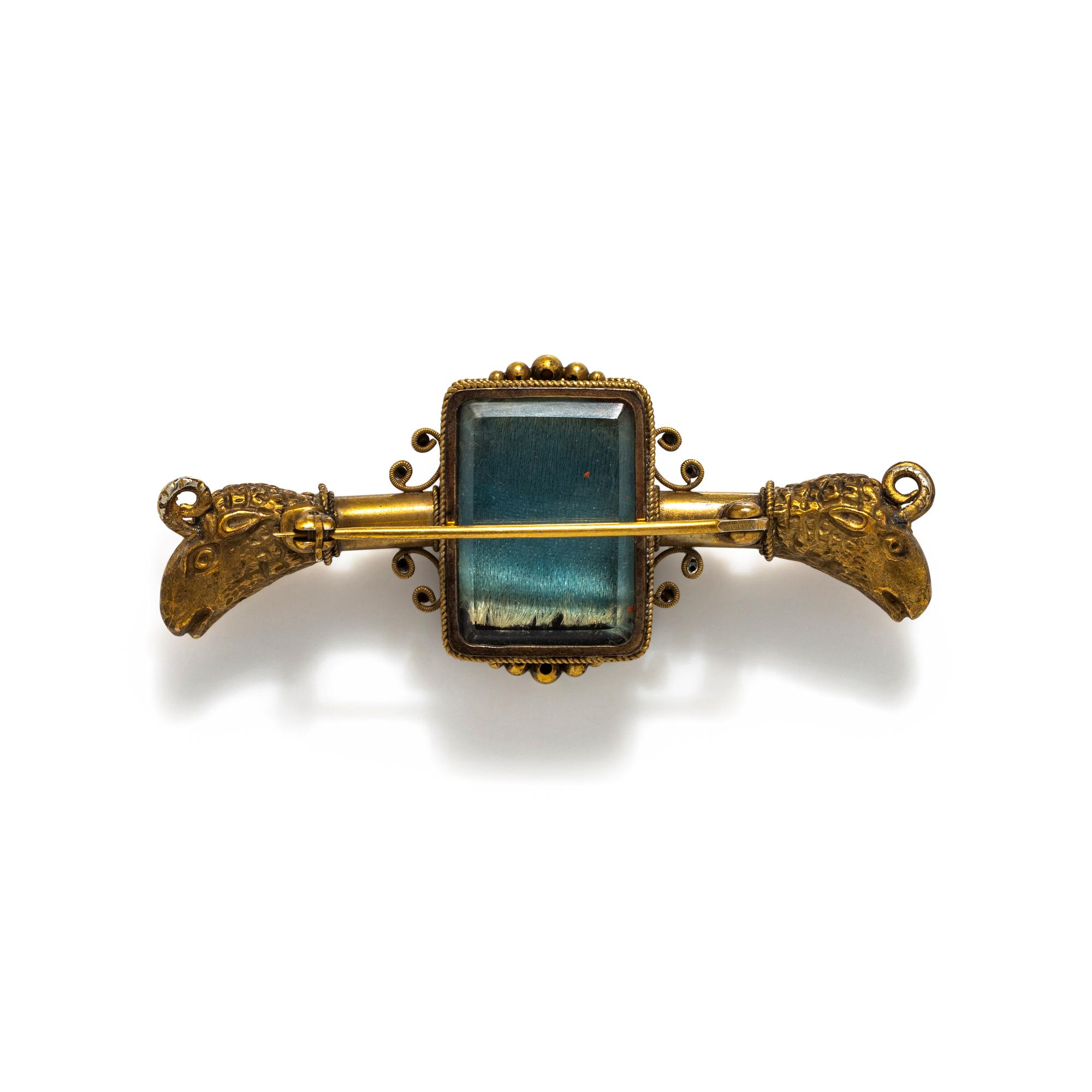 ANTIQUE, GILT AND CARVED INTAGLIO BROOCH