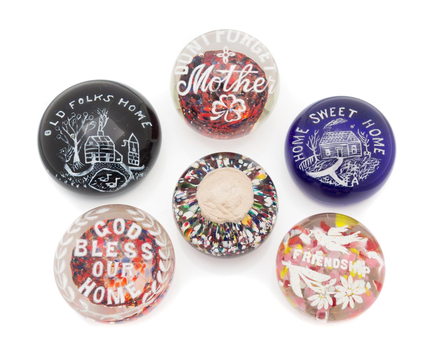 Six Glass Paperweights Diameter of largest 3 3/4 inches
