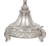 A Set of Four Continental Silvered Metal Candlesticks