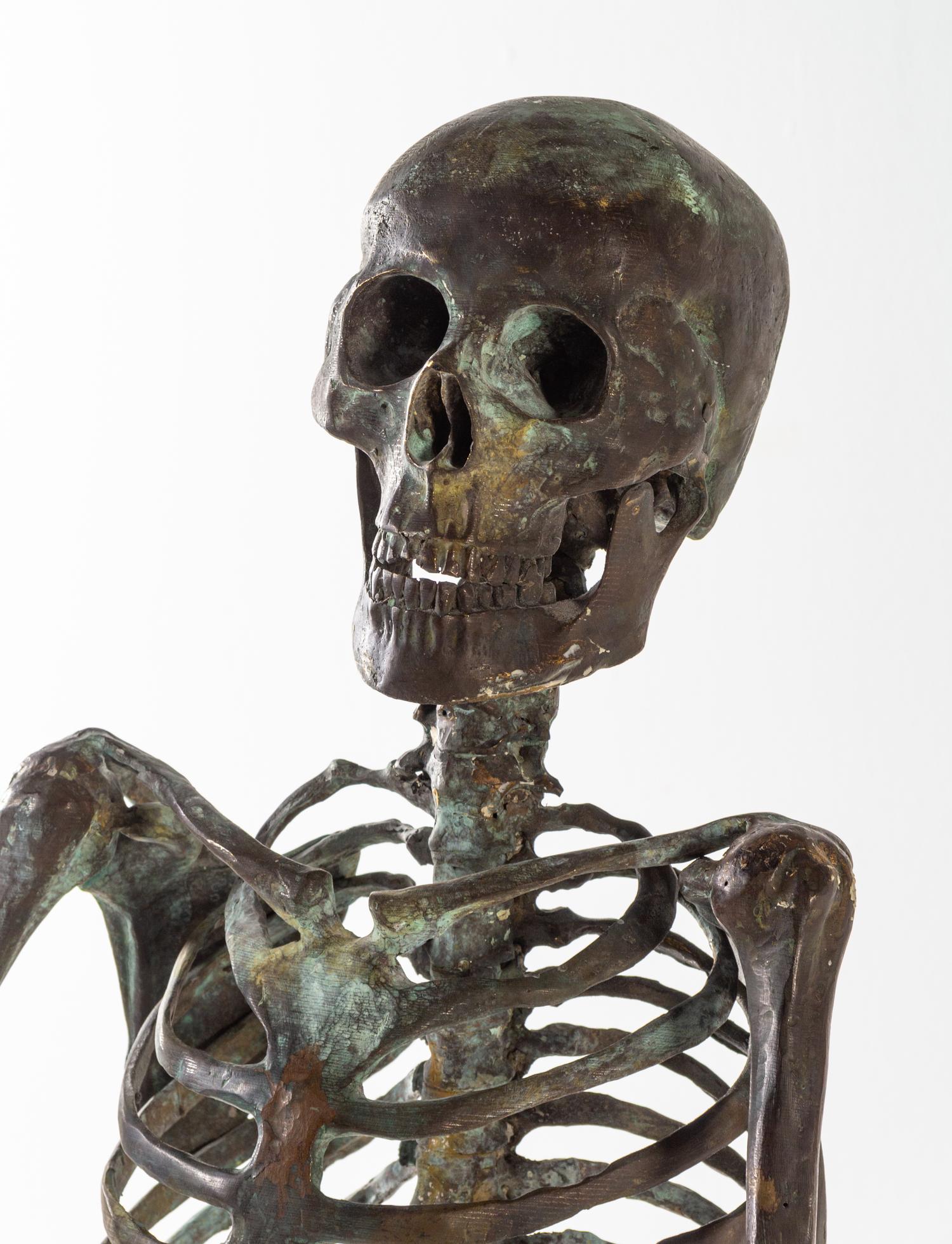 A Bronze Skeleton Figure Height overall 58 1/2 inches. — 20TH CENTURY
