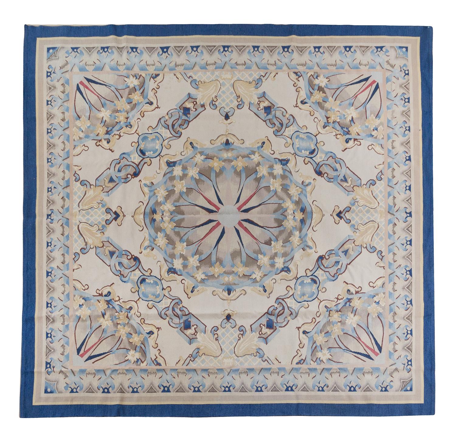 A Continental Wool Rug — 20TH CENTURY