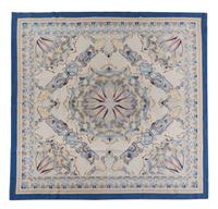 A Continental Wool Rug — 20TH CENTURY