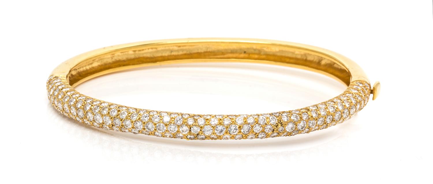 An 18 Karat Yellow Gold and Diamond Bangle Bracelet, 13.60 dwts.