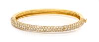 An 18 Karat Yellow Gold and Diamond Bangle Bracelet, 13.60 dwts.