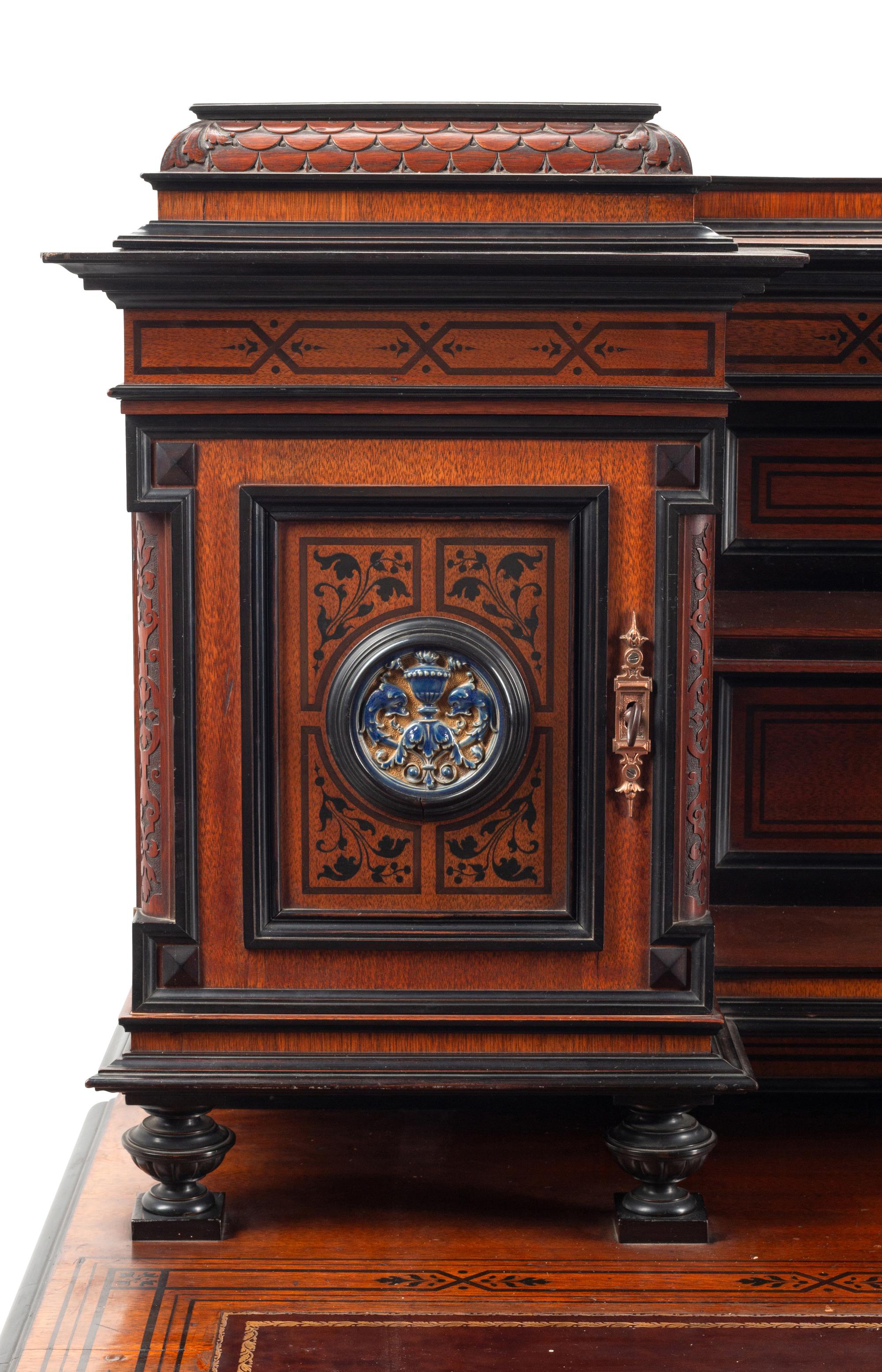 An English Aesthetic Movement Walnut, Part Ebonized and Glazed Earthenware Plaque-Inset Bureau Cabinet