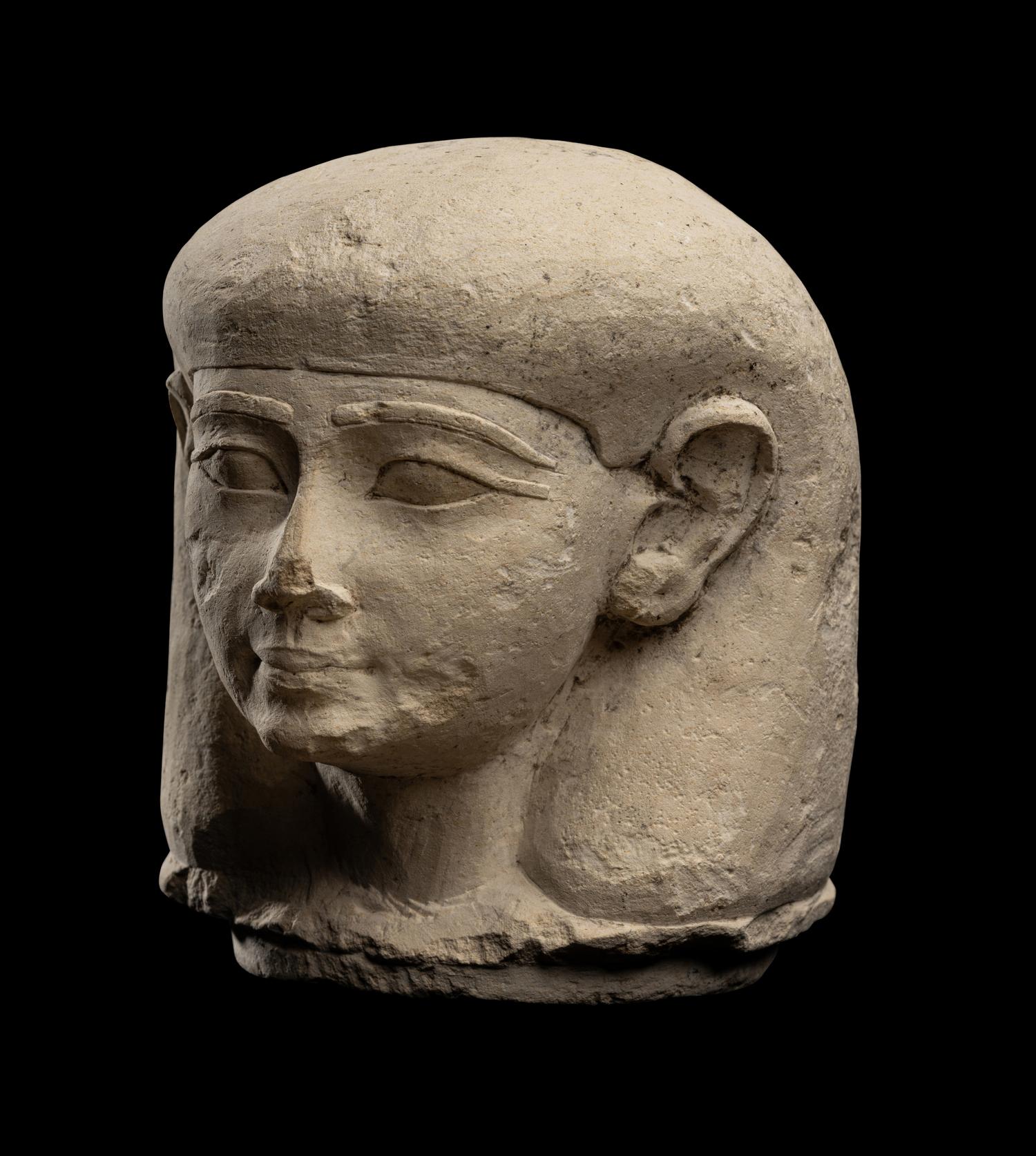 An Egyptian Limestone Canopic Jar Lid for Imseti