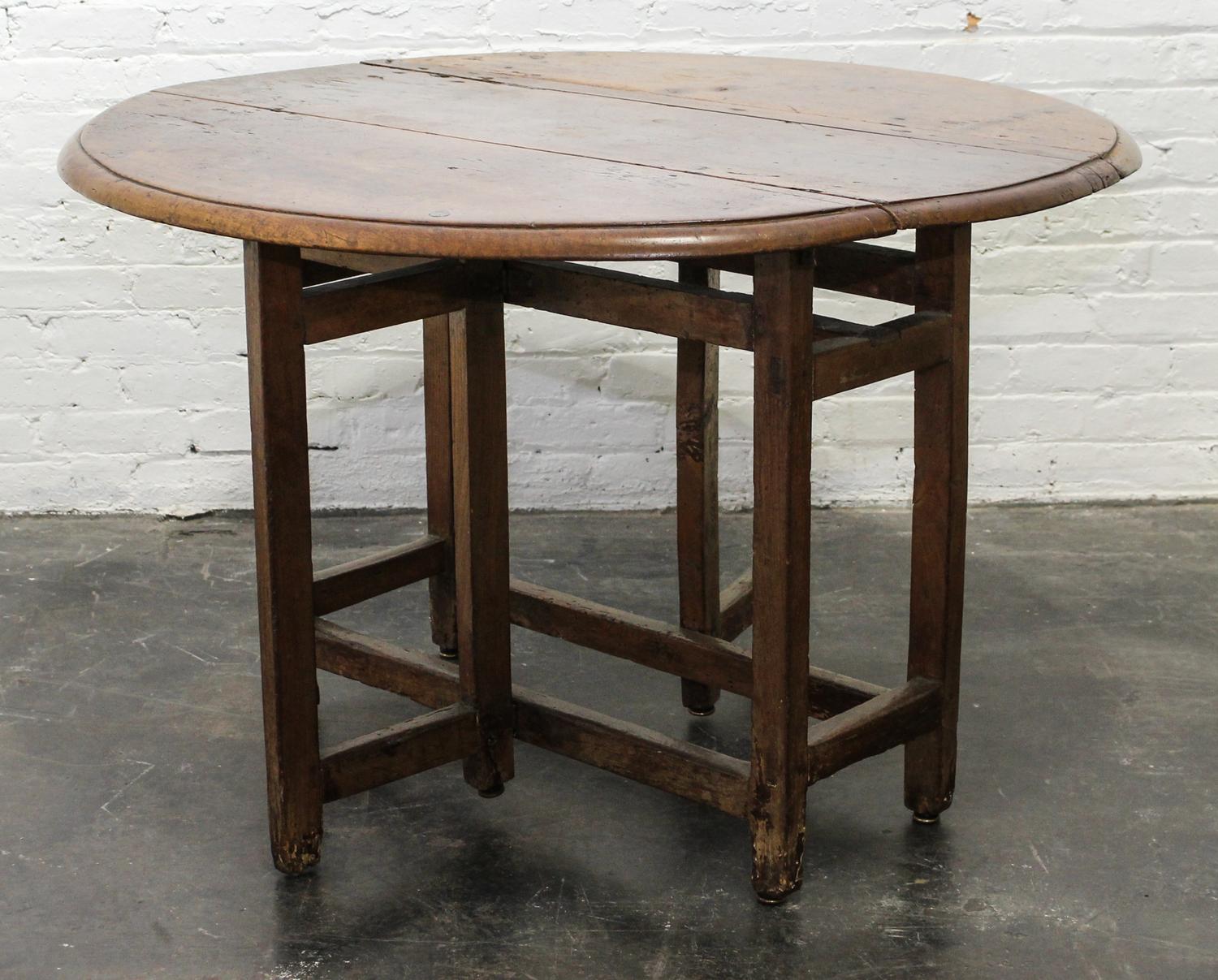 A Jacobean Oak Drop Leaf Table Height 28 x width 42 1/2 x depth 15 1/4 inches (closed). — 18TH/19TH CENTURY